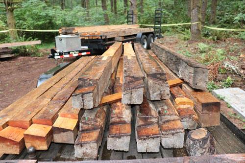 Hand-hewn Douglas-fir logs stack tightly together to without gaps to keep out the weather.