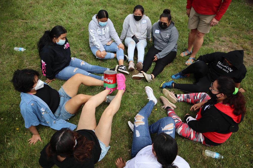 Students in the Juntos Afuera summer camp play a game.