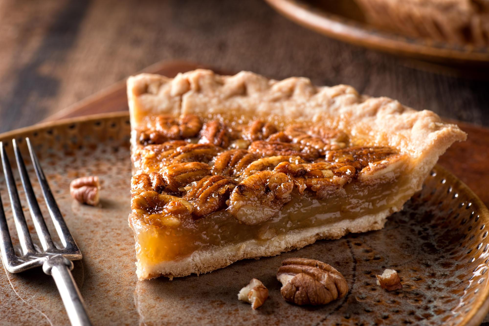 A slice of pecan pie on a plate.