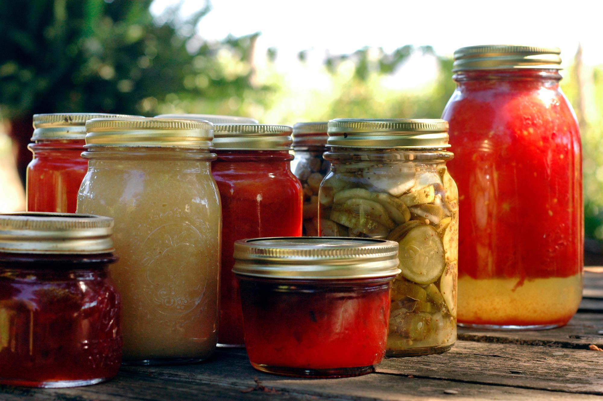 A variety of canned goods in glass Mason jars.