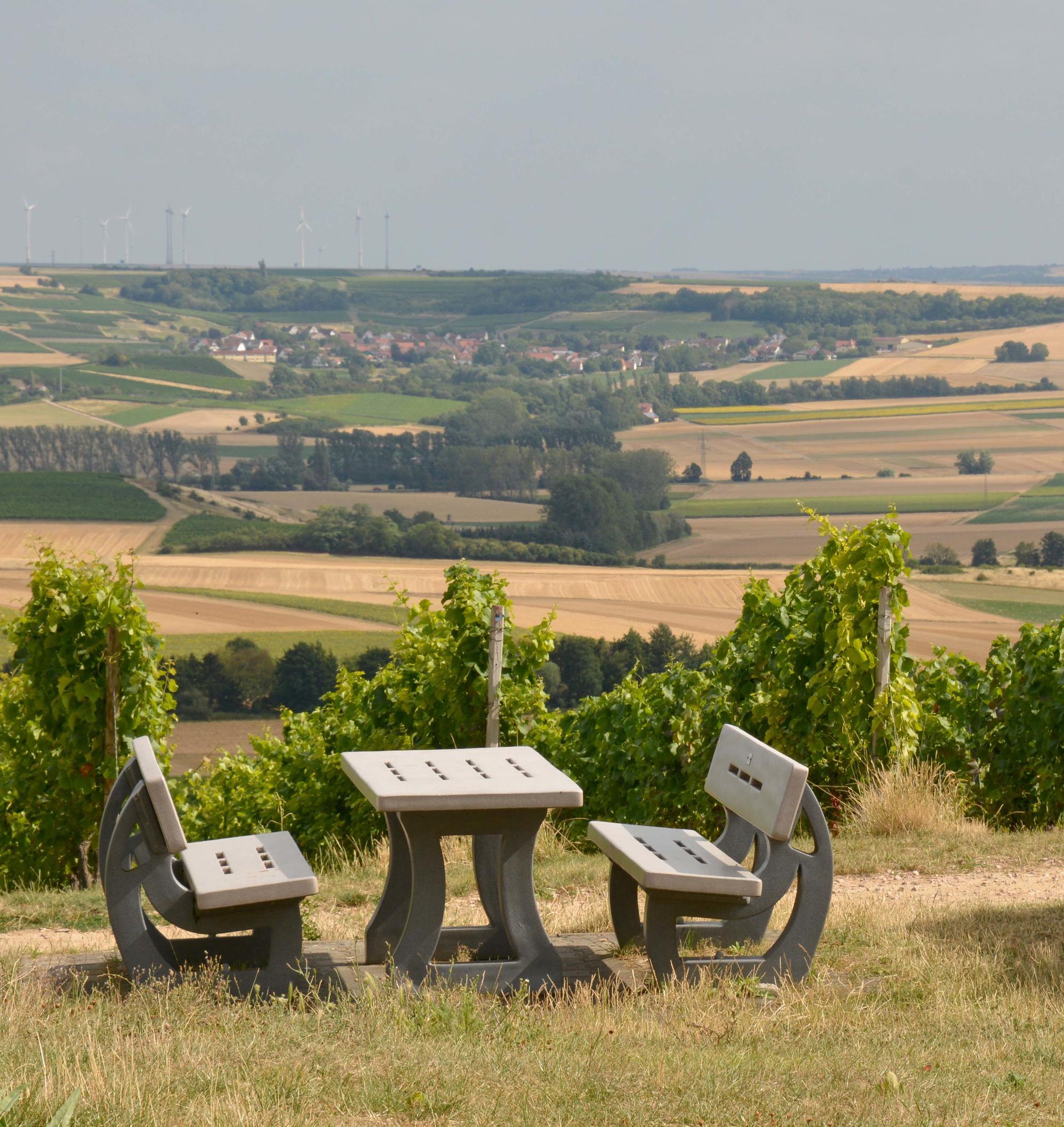 picnic table and benches in countryside