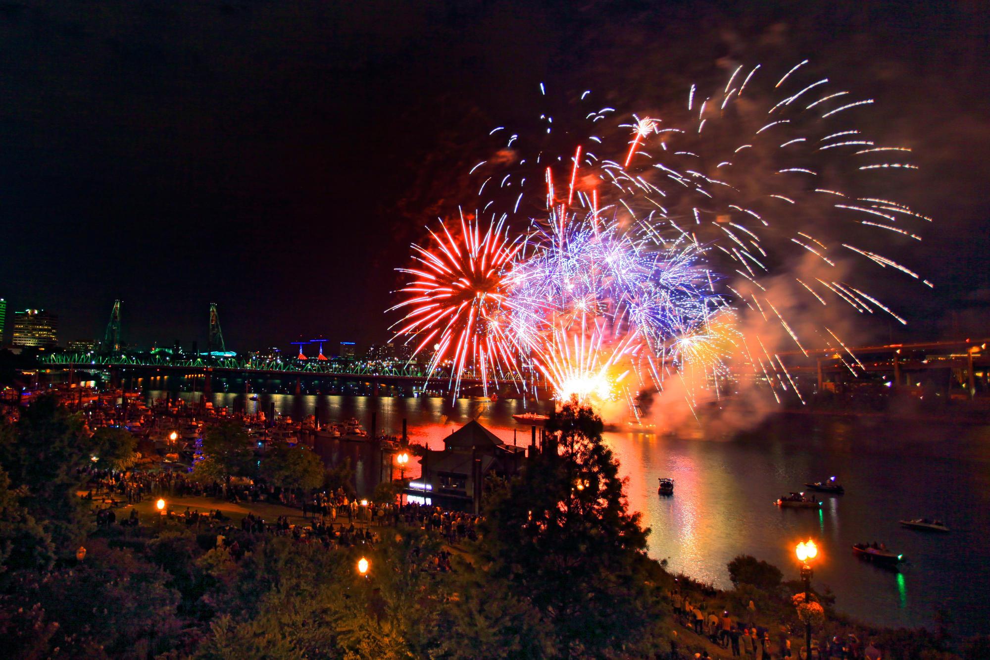 Fireworks being detonated over the waterfront in Portland, Oregon.