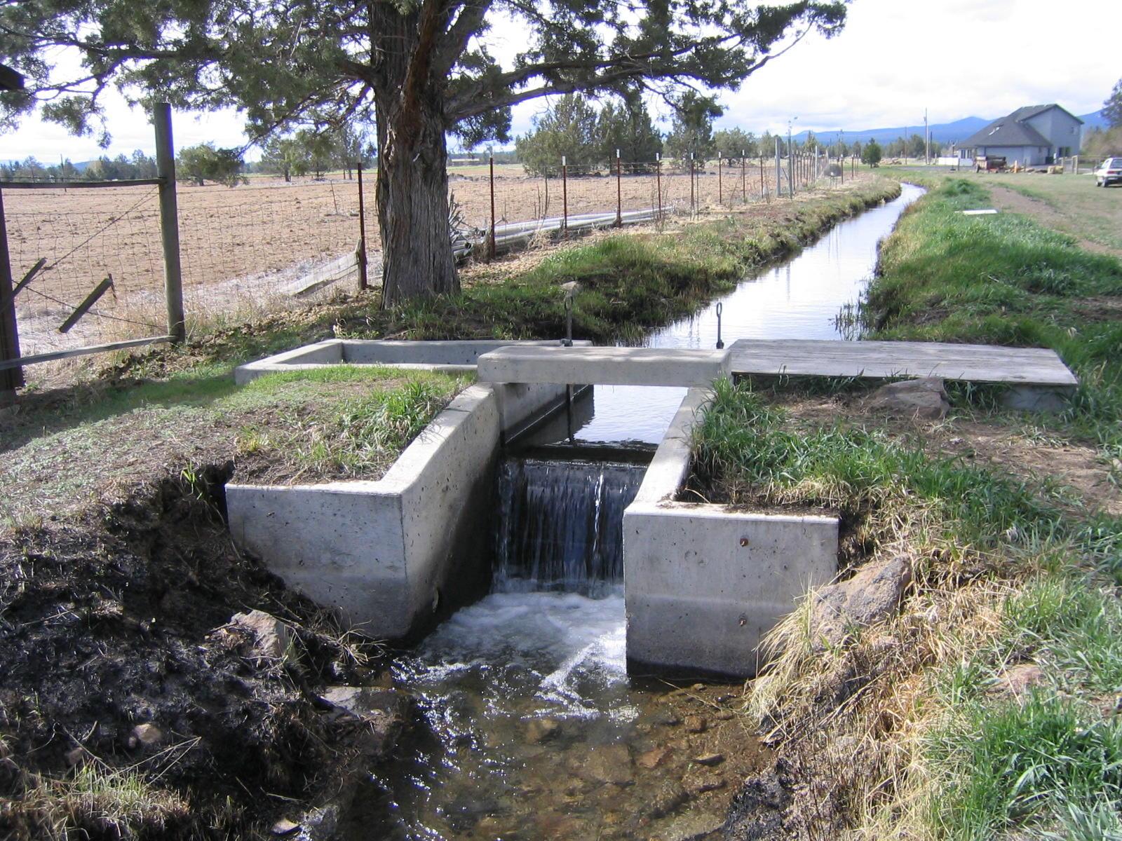 an irrigation canal in a field