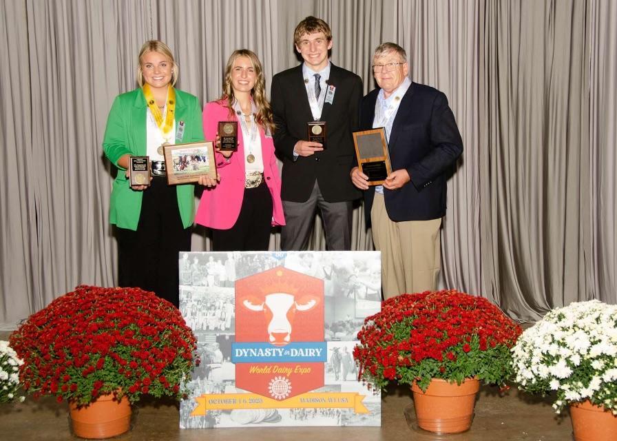 Clancey Krahn (from left), Peyton Rawe, Logan Lancaster and Jim Krahn pose with their awards at the 2023 National 4-H Dairy Cattle Judging Contest.