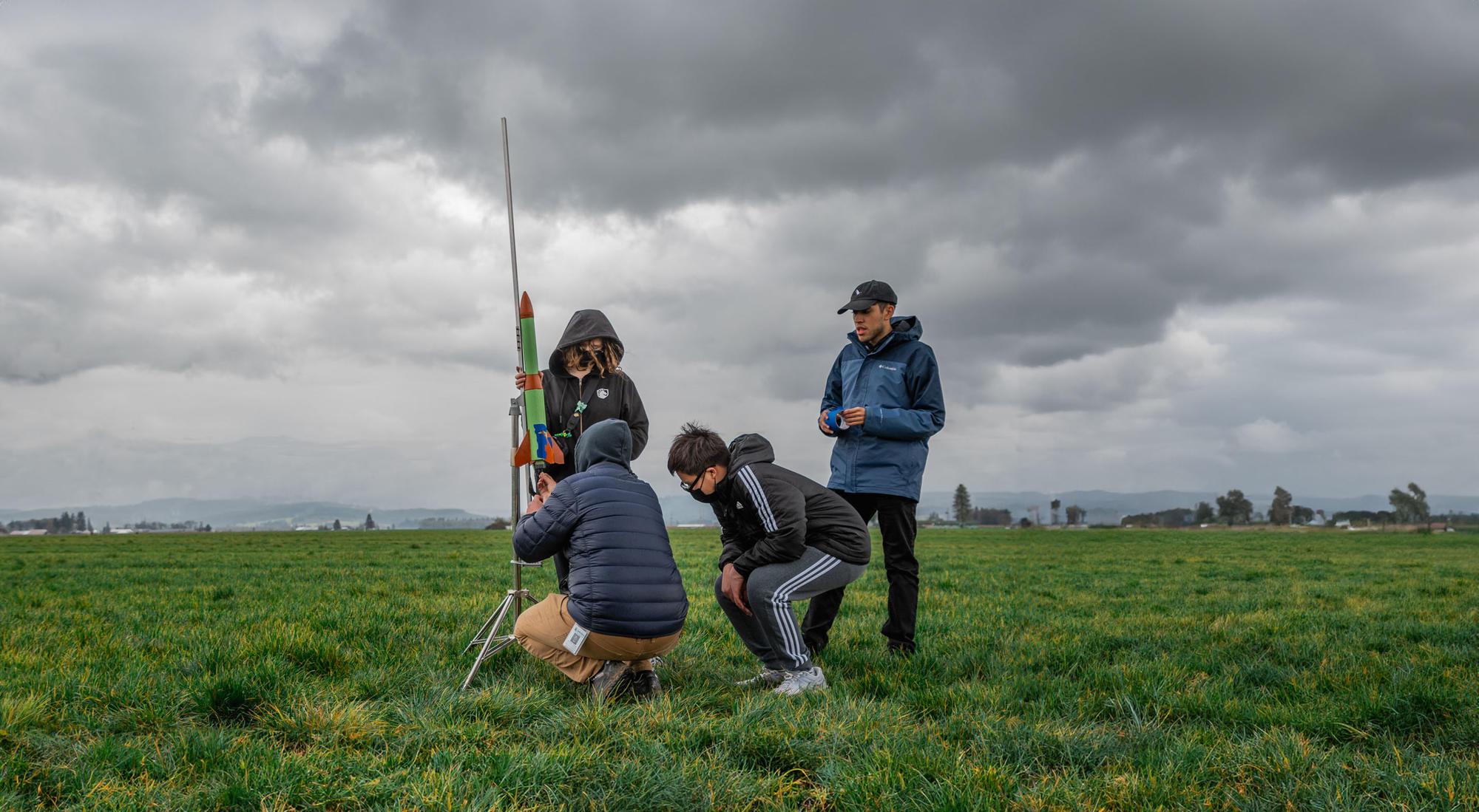 Members of the Douglas County rocketry club prepare for a launch