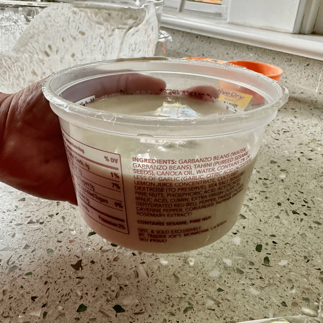 plastic container with beige liquid