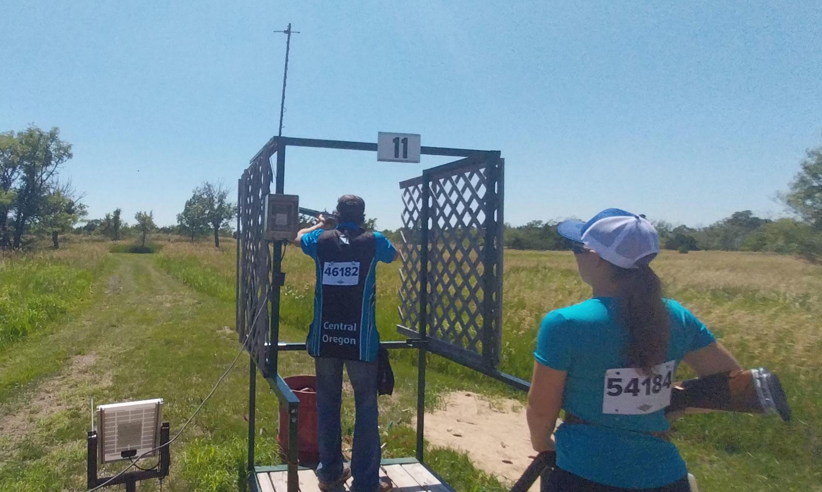 A 4-H competitor uses a shotgun in the clay target competition.