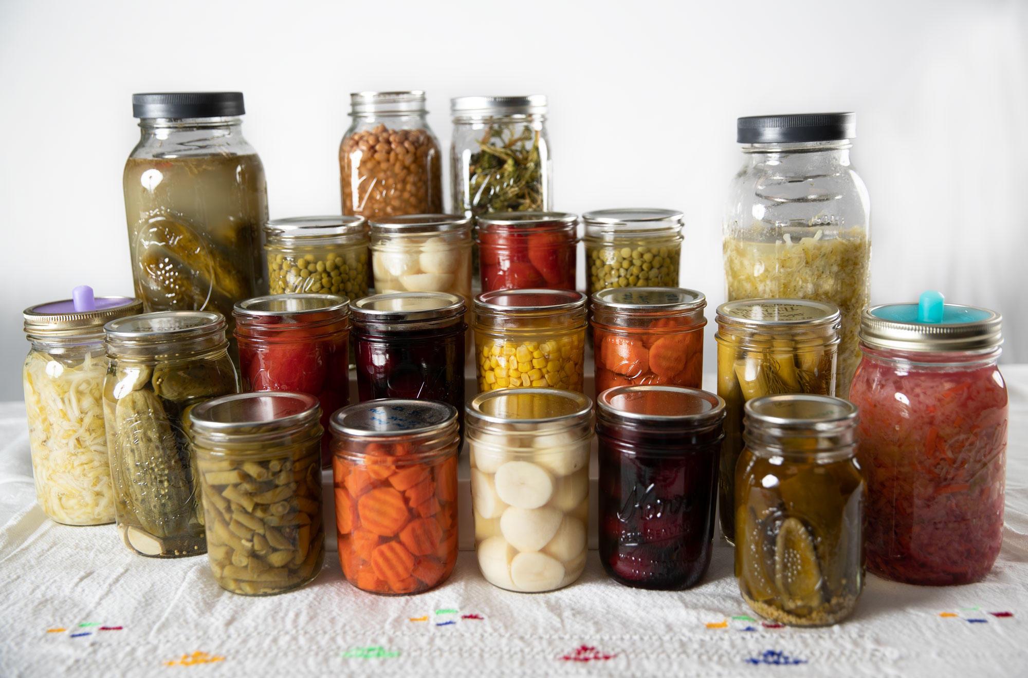 Canned vegetables displayed on a table with a white background.