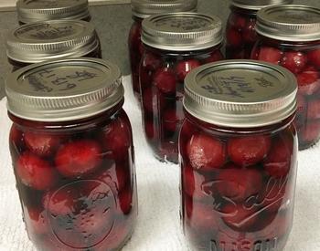 Jars of canned Bing cherries