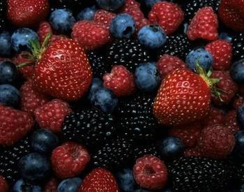 A close-up view of mixed berries including strawberries, blueberries, blackberries and raspberries.