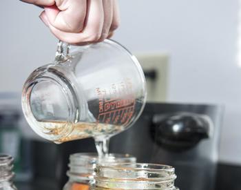 Preserved food being prepared in jars
