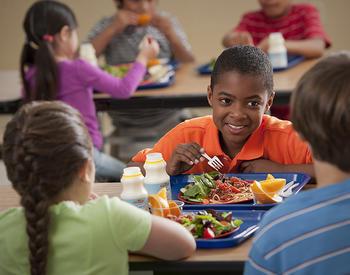 Children eating lunch in cafeteria