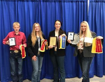 OSU Extension 4-H horse judging team poses with their ribbons and plaques at the Eastern National 4-H Horse Roundup.