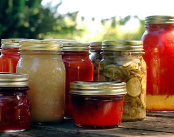 A variety of canned goods in glass Mason jars.