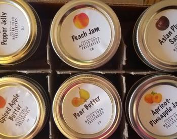 jars of jam and jelly in a box