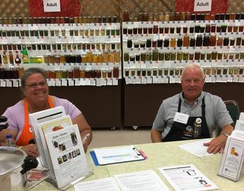 MFP volunteers answering questions at the food preservation display at the Deschutes County Fair