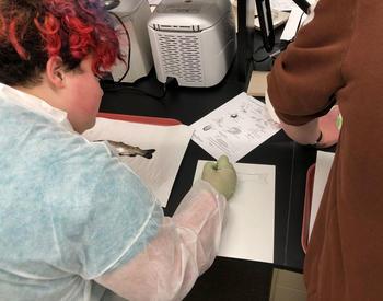 Students from Alliance at Joseph Meek Technical High School prepare to dissect a fish at Oregon State University’s John L. Fryer Aquatic Animal Health Laboratory.