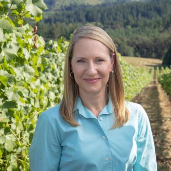 Dr. Patty Skinkis standing in OSU's research vineyard