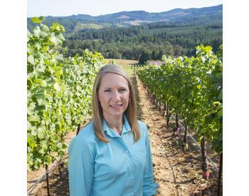 Patty Skinkis stands in Oregon State University's Woodhall Vineyard